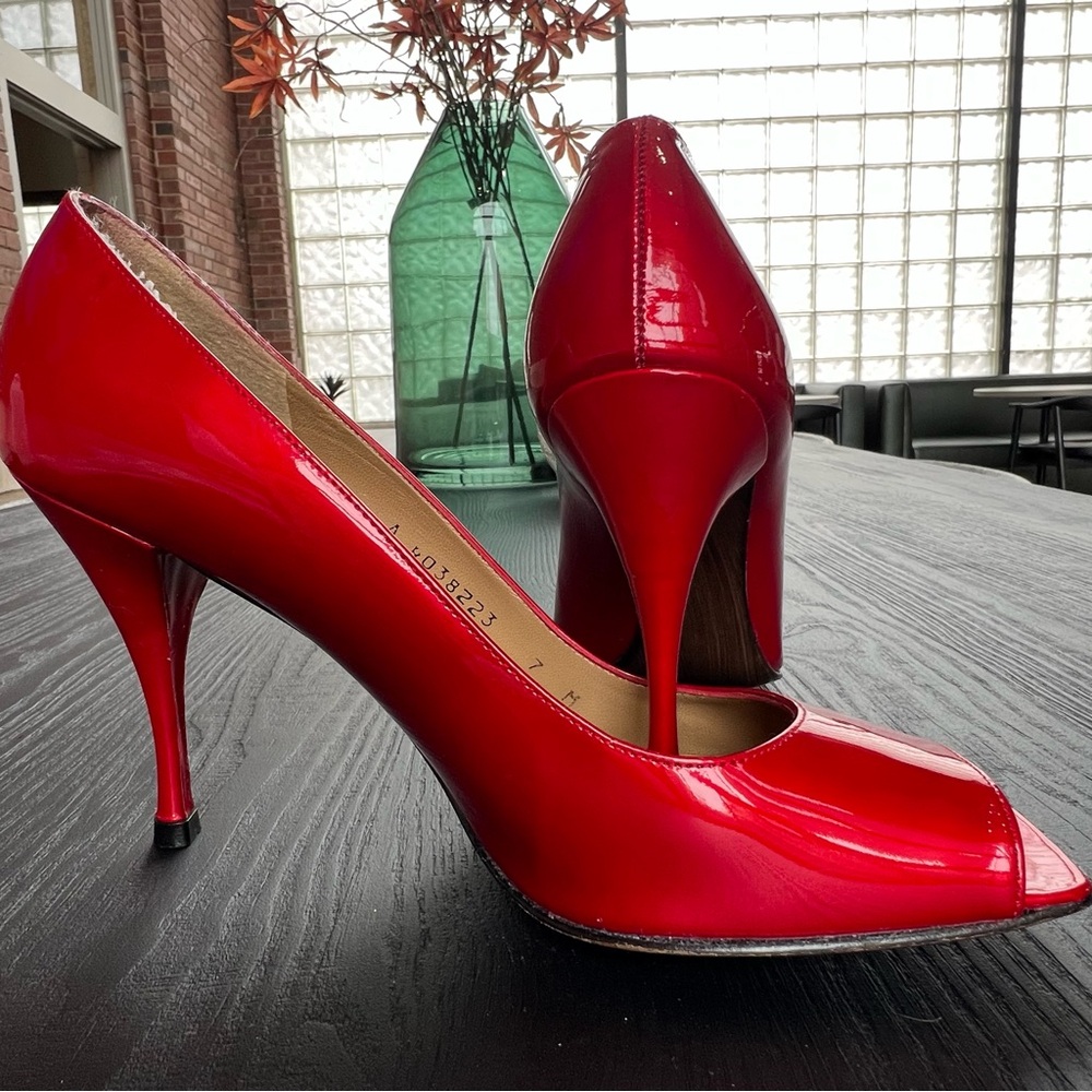 Stuart Weitzman red patent leather shoes
Size 7 M Open Toe 3-inch heels